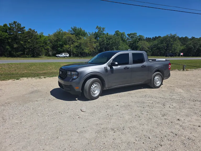 Gray Ford Maverick pickup with new window tint in the sun